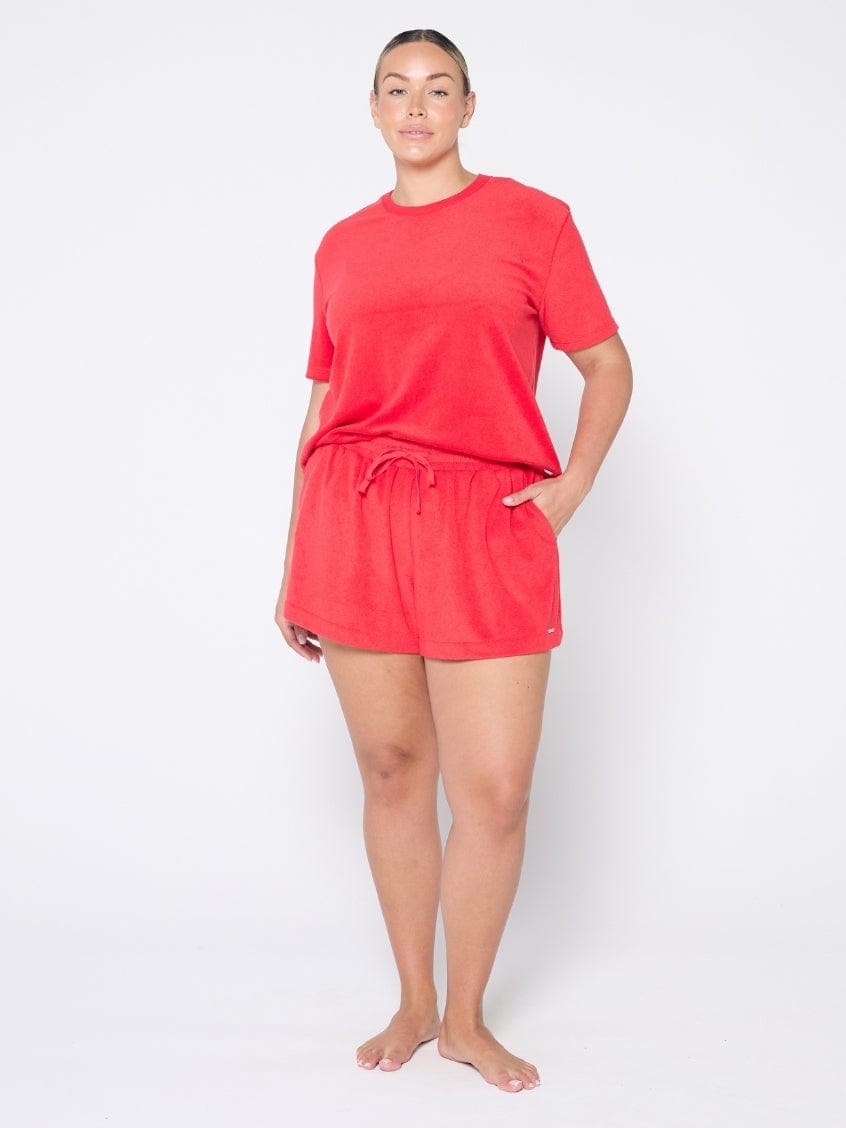 Person wearing a red outfit on a white background