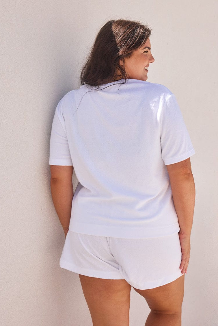 Back of curve model wearing white terry towelling t shirt
