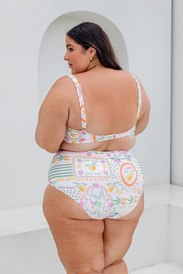 Back of model wearing square neck bikini with adjustable straps and clasp at back