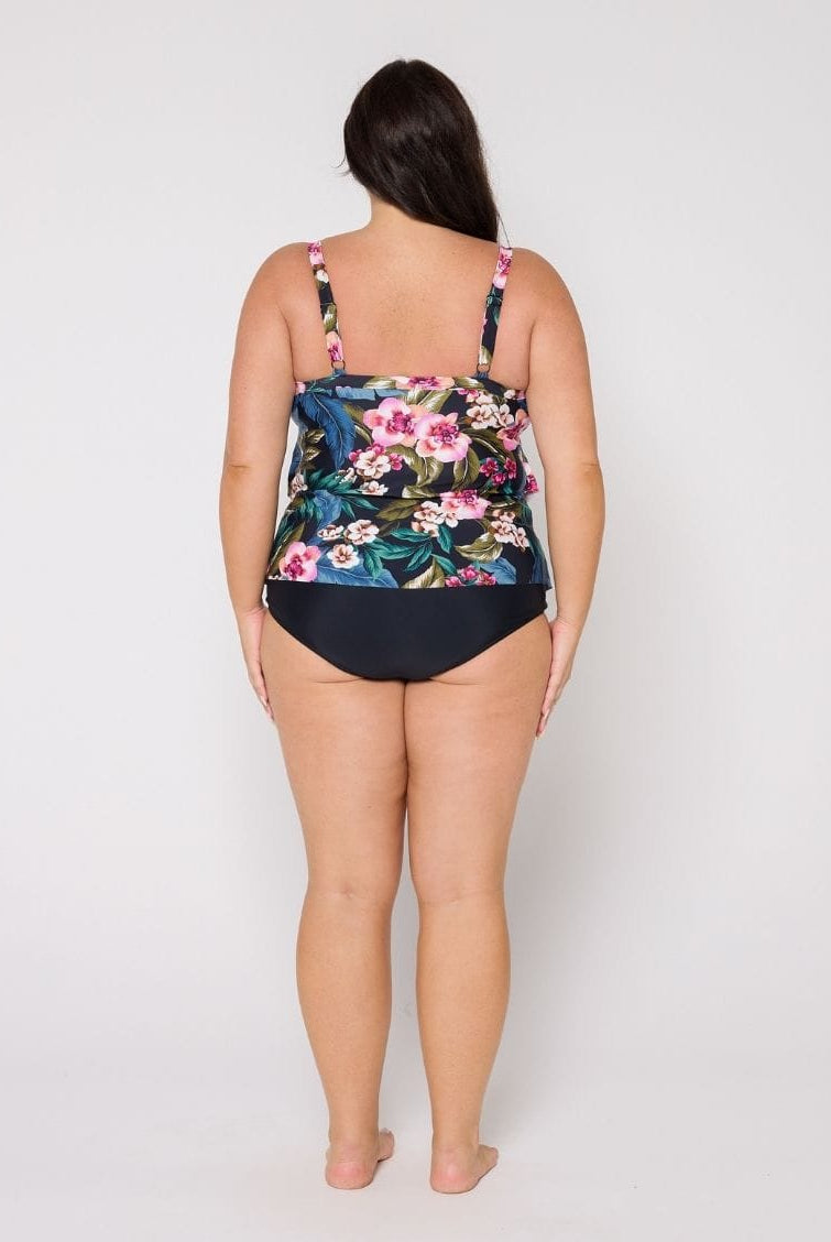 Back of woman wearing a multi coloured tankini top in studio with floral print and adjustable straps