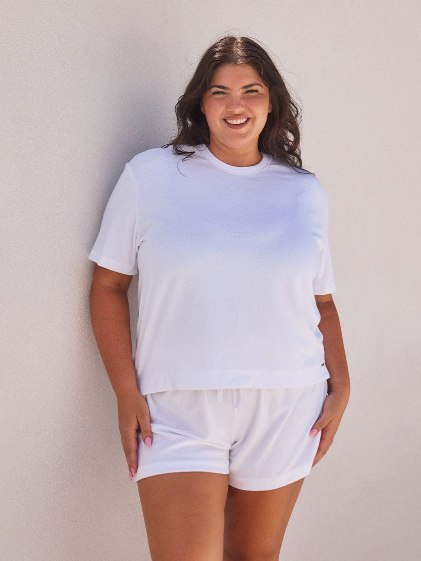 Woman wearing a white terry towelling t shirt for curve women