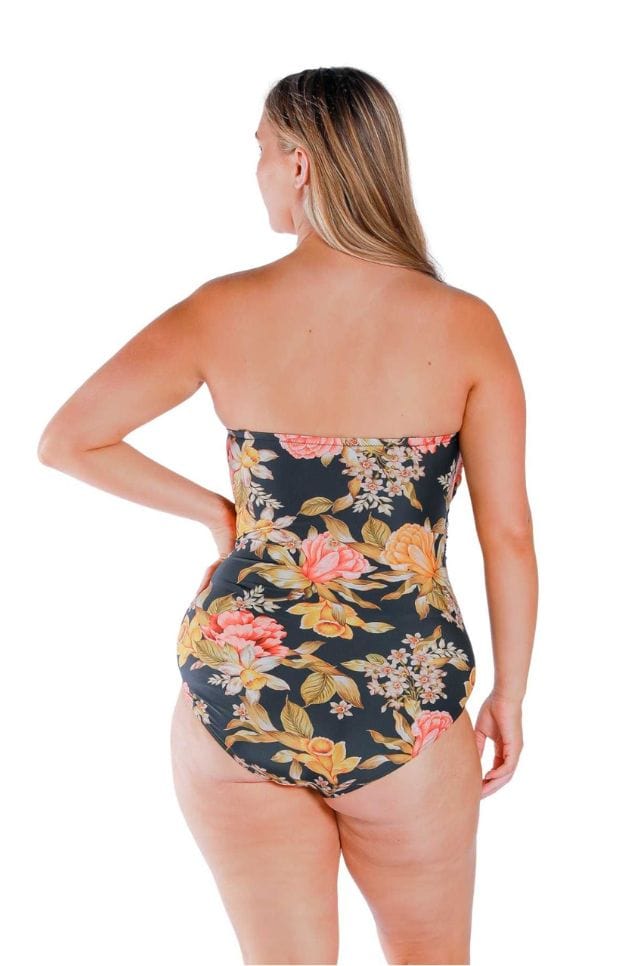 Back of model wearing a plus size one piece with flattering stomach ruching in floral print Australia