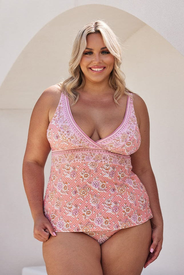 Blonde model wearing pink floral v neck tankini top