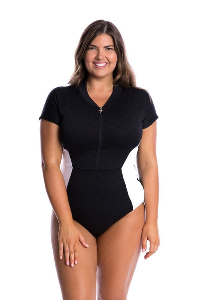 Curve model wearing zip front one piece in black and white with texture pattern
