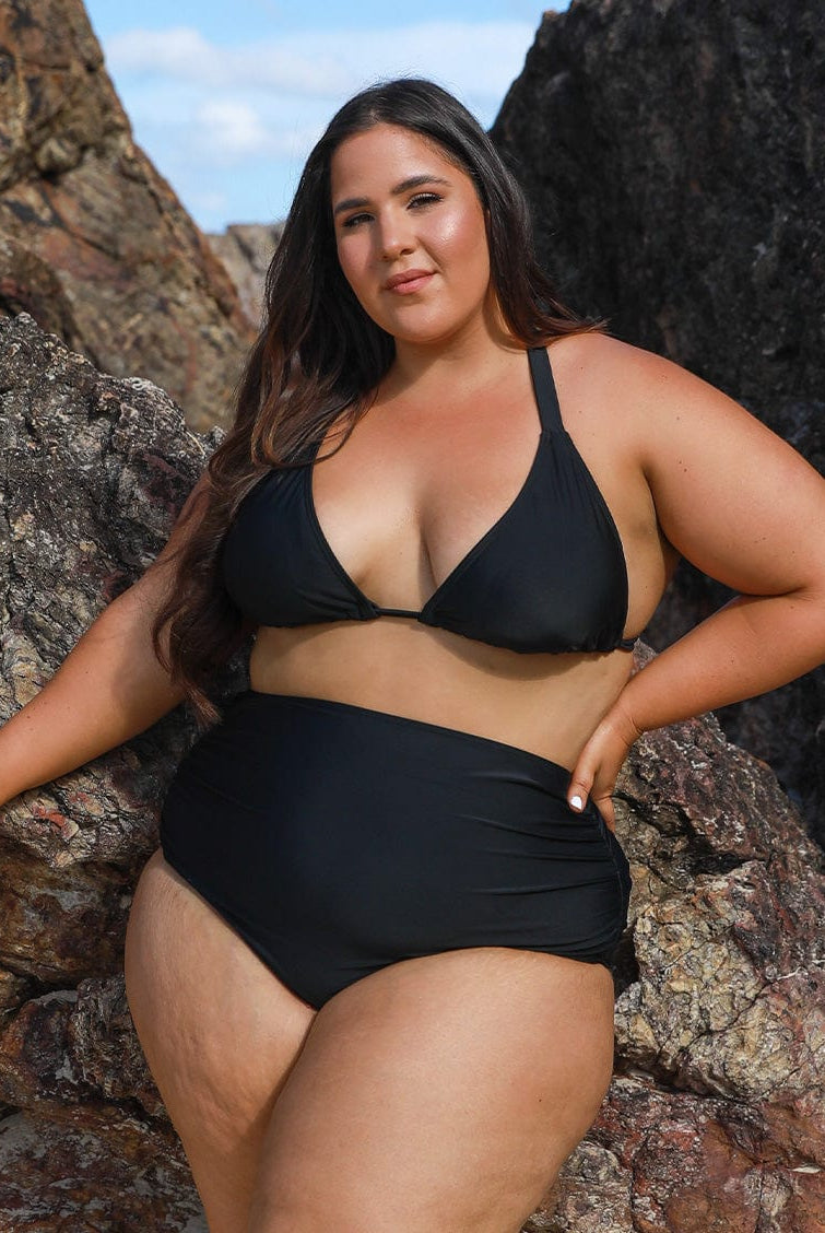 model wearing black triangle bikini top