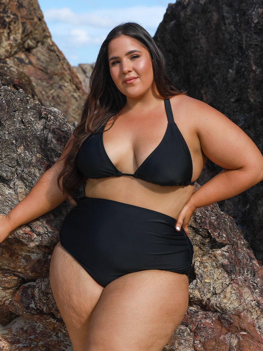model wearing black triangle bikini top