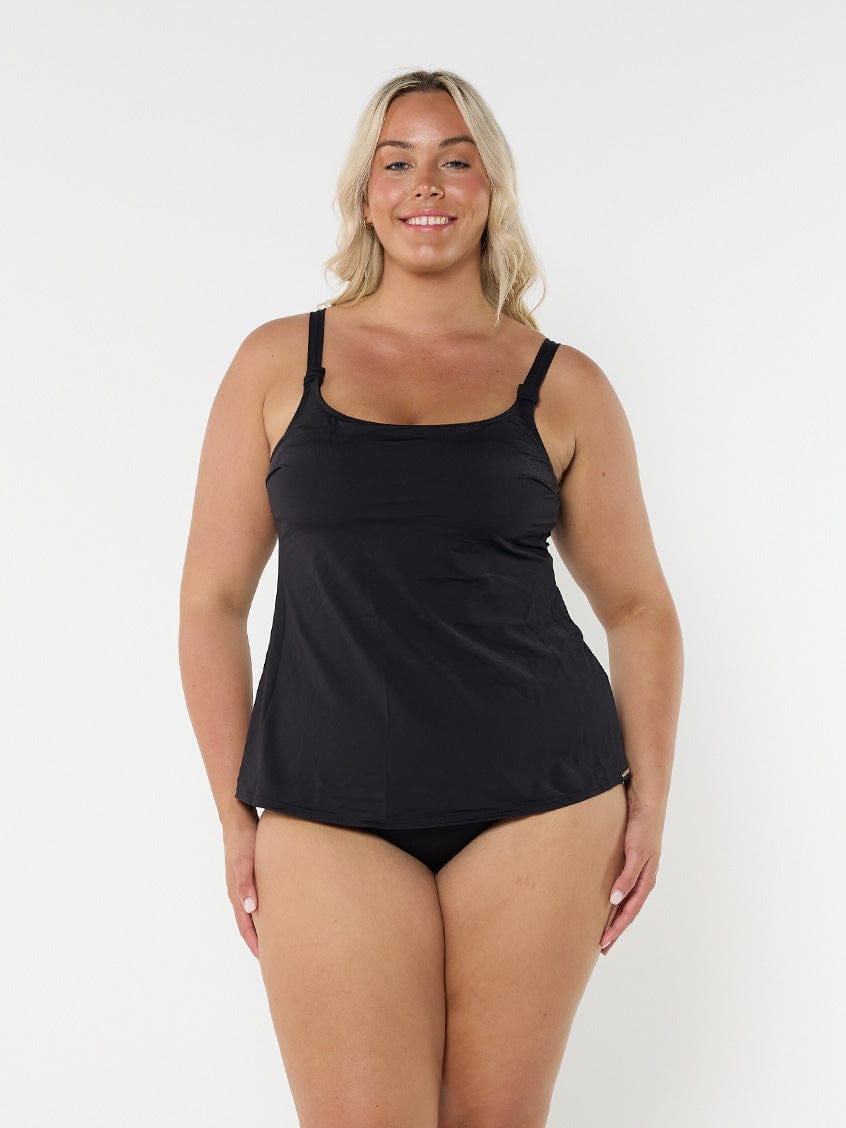 model wearing black tank tankini top with matching bottoms