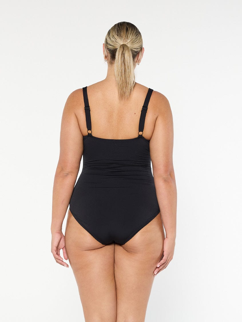 model showing back of black ruched one piece
