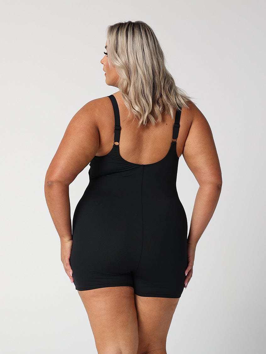 model showing back of longer leg black one piece