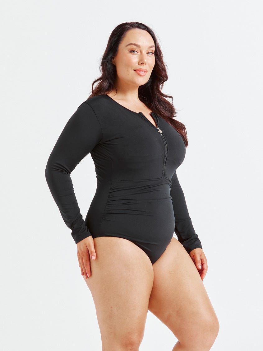 model showing side of black long sleeve one piece
