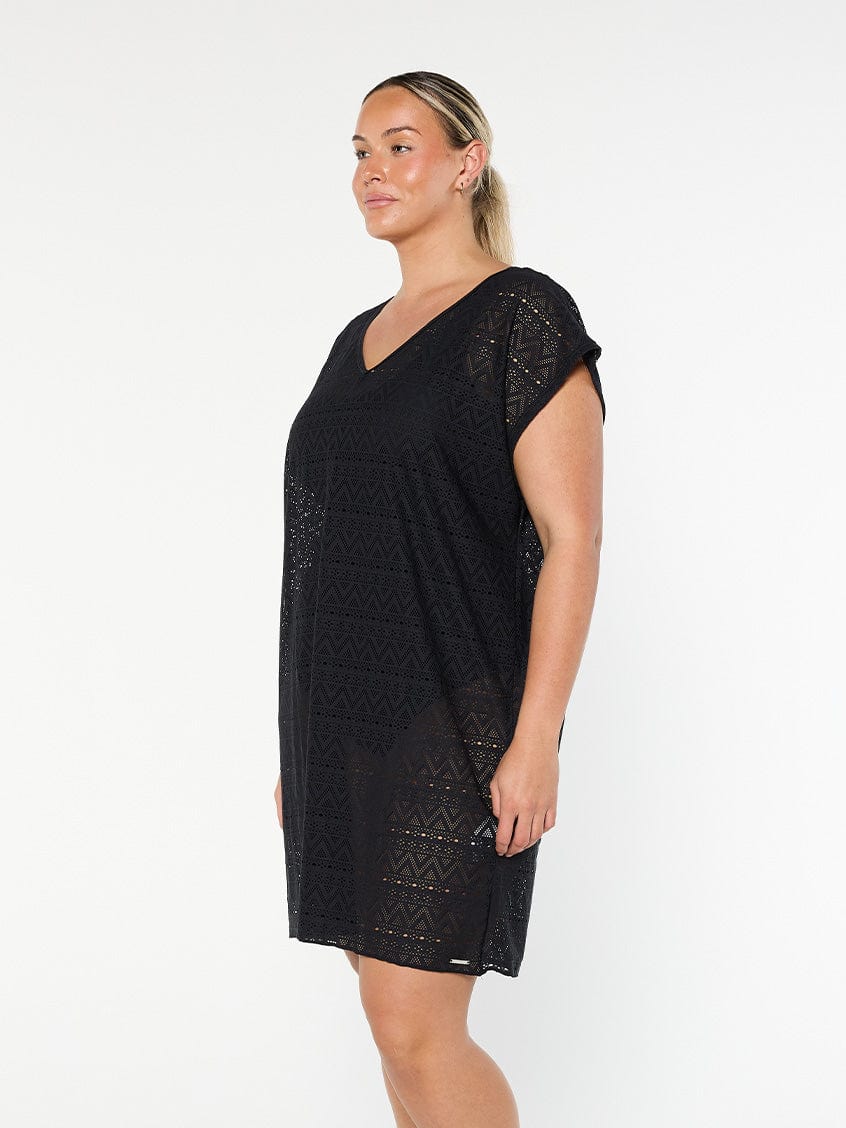 model showing side of black mesh cover up