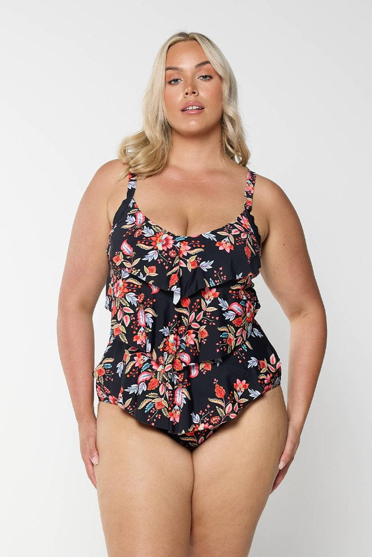 model wearing black and red floral women's one piece