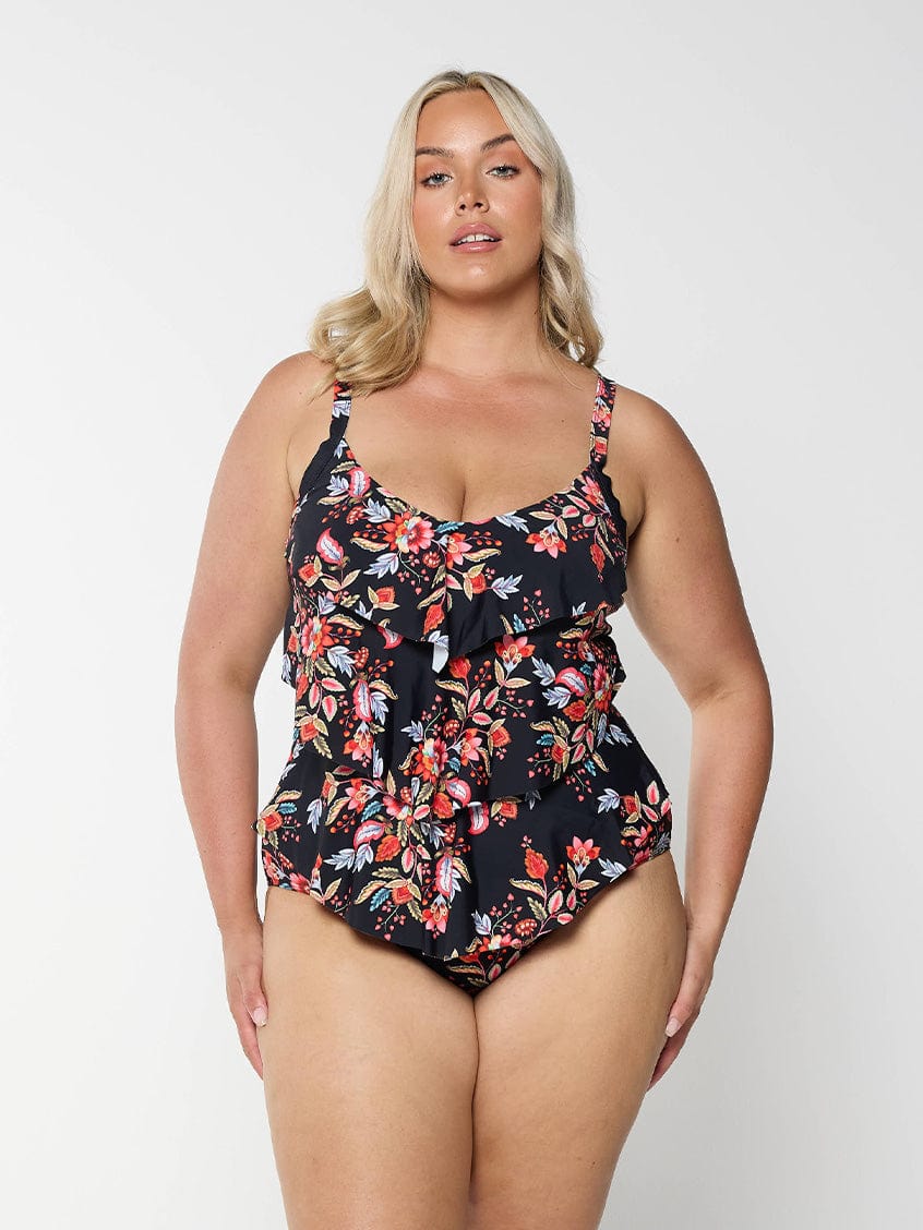 model wearing black and red floral women's one piece