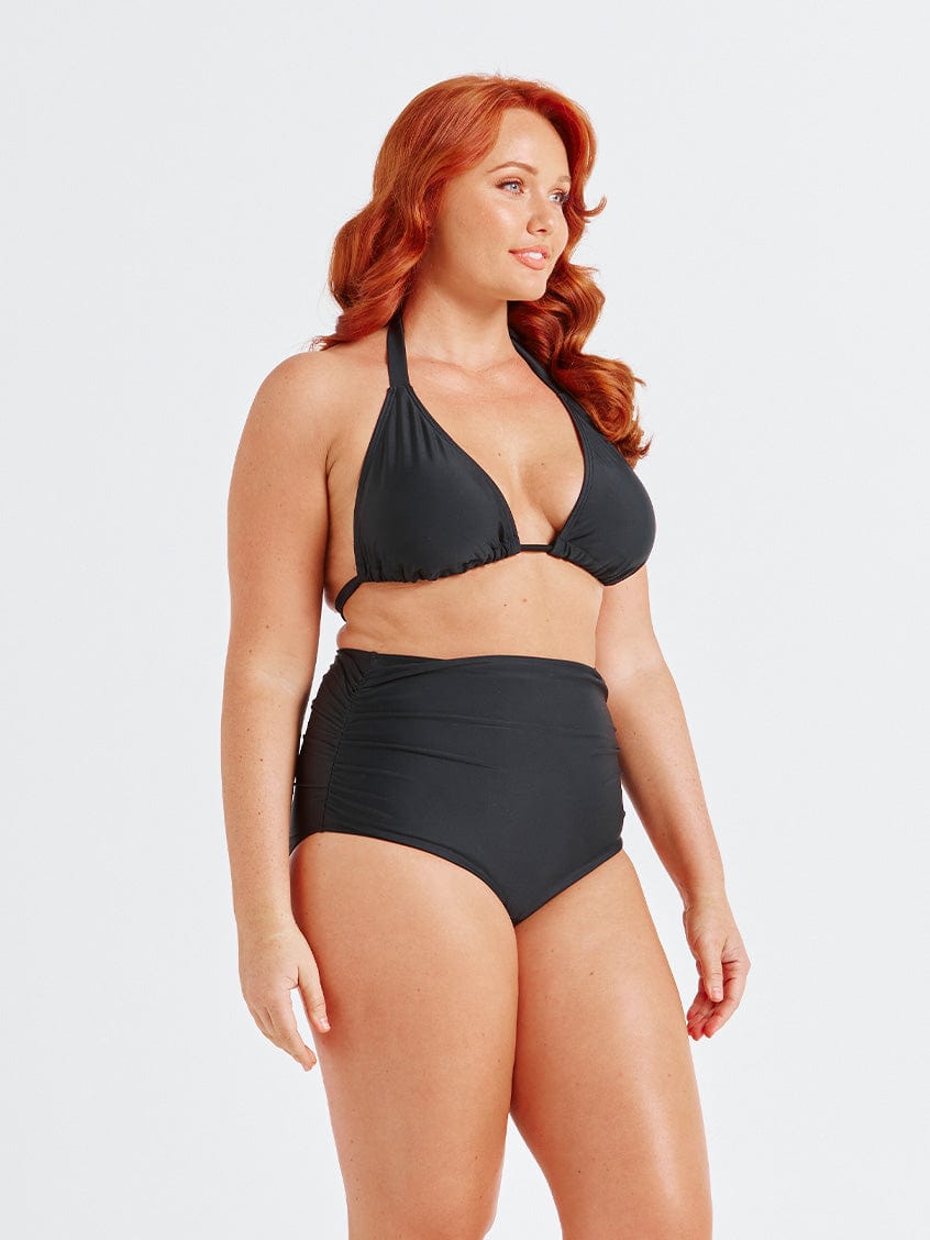 model showing side ruching on black high waisted swim pant