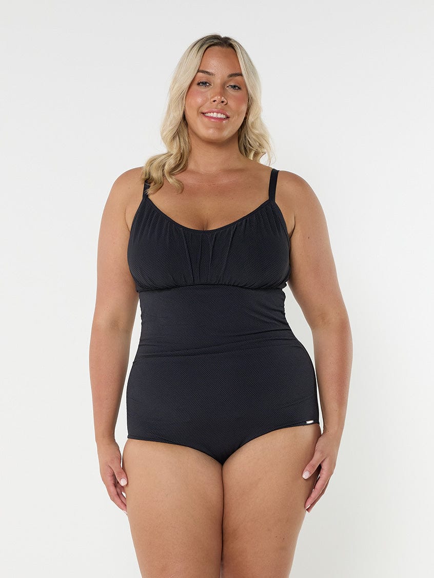 curve model wearing black textured underwire one piece