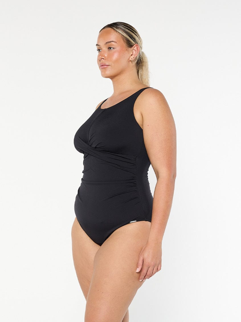 model showing side of black twist front one piece