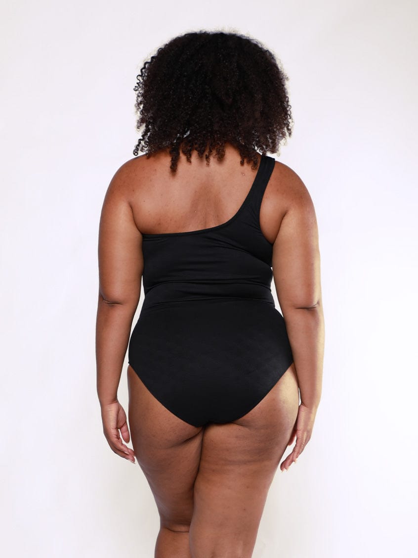 Women wears high back one shoulder one piece in black