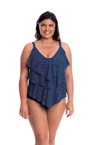Model wearing navy and white dots 3 tier tankini