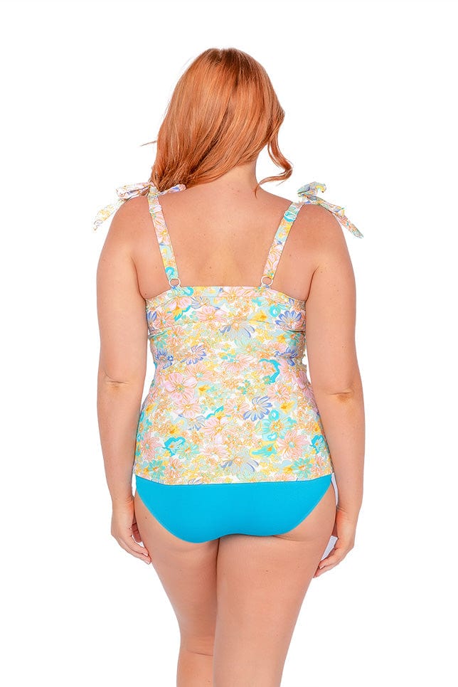 Back of model wearing curvy floral tankini with adjustable straps and tie detail