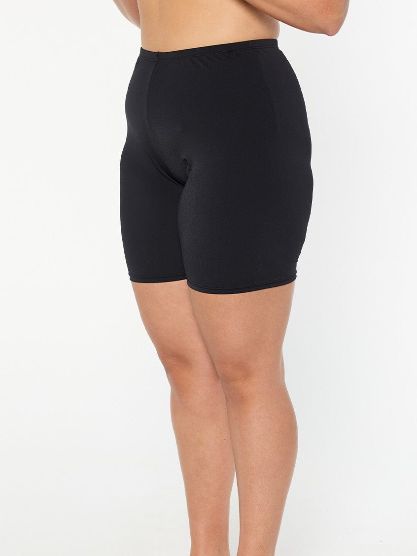 model showing side of black swim bike shorts