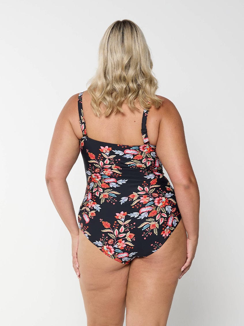 model showing back of flattering red floral swimsuit