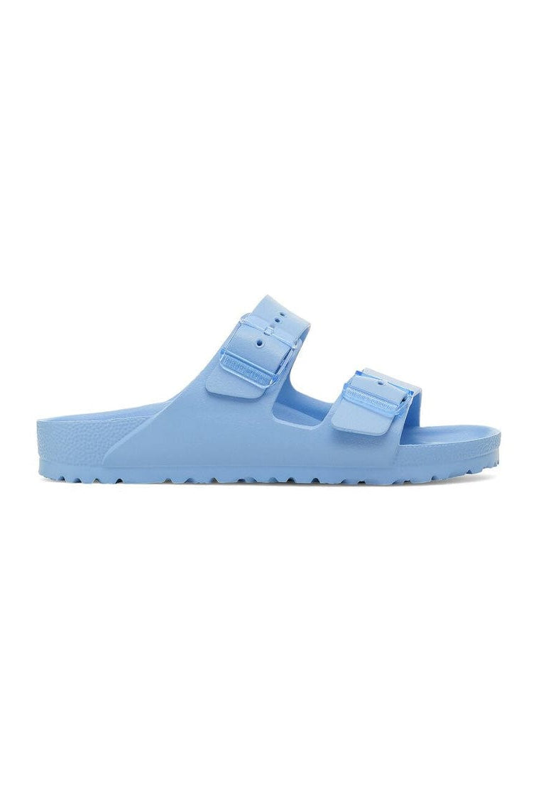 Light blue sandal with double straps on a white background