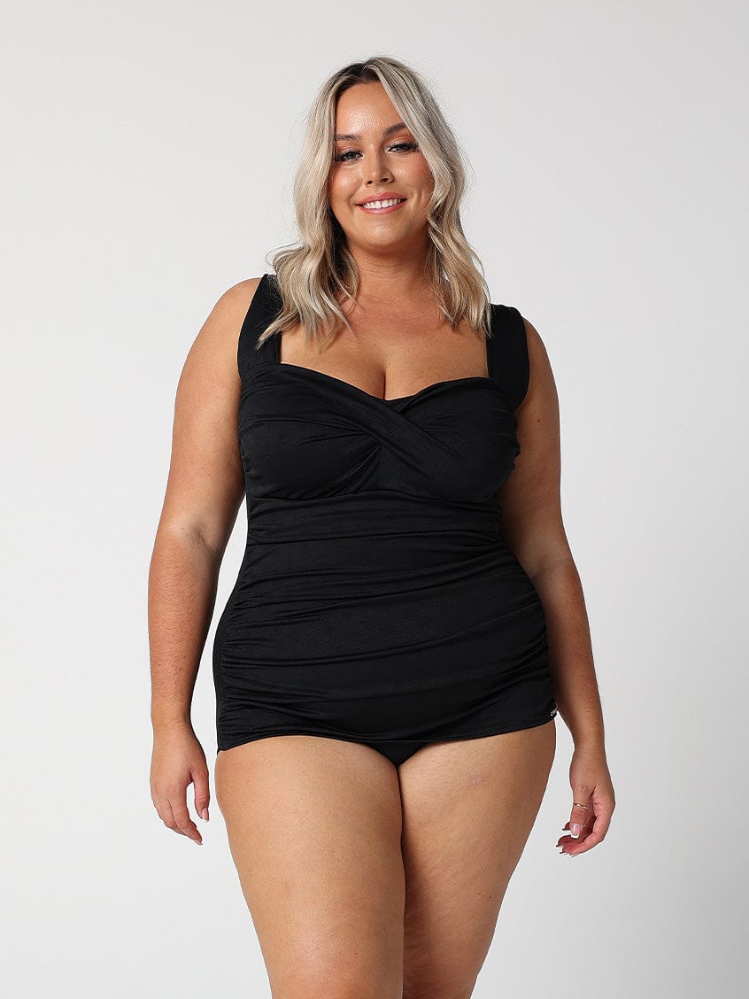 model wearing black textured retro one piece