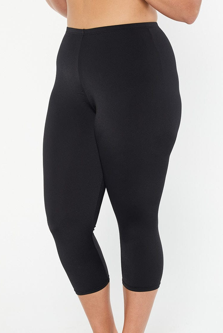 model showing side of women's black swim leggings