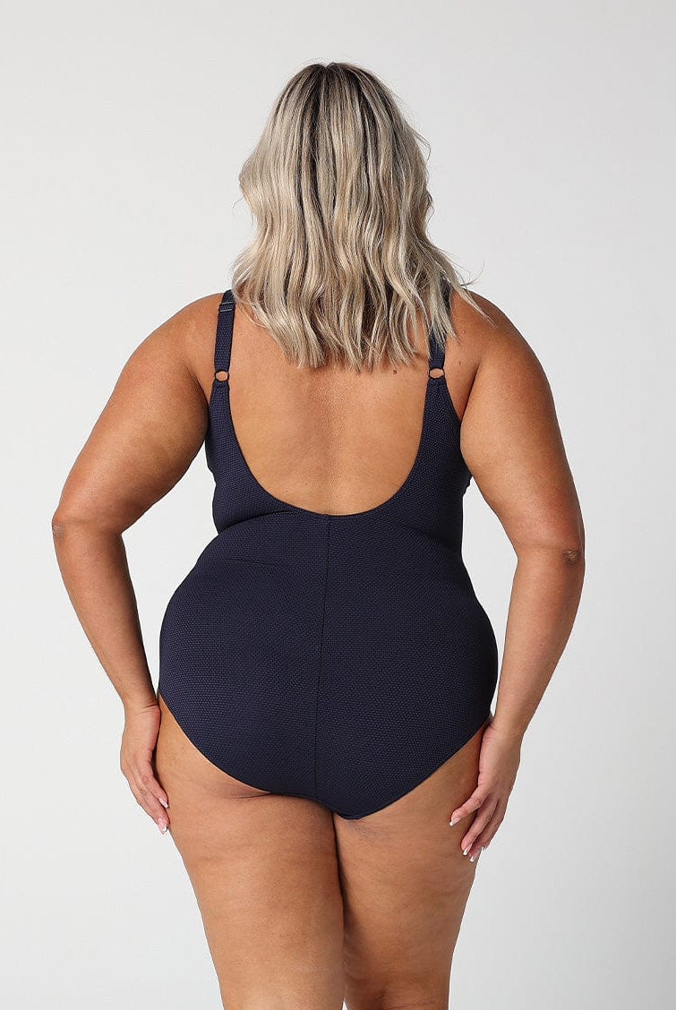 model show back of low back navy textured swimsuit