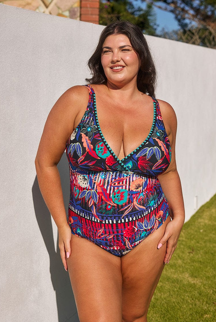 model wearing vibrant floral v neck swimsuit