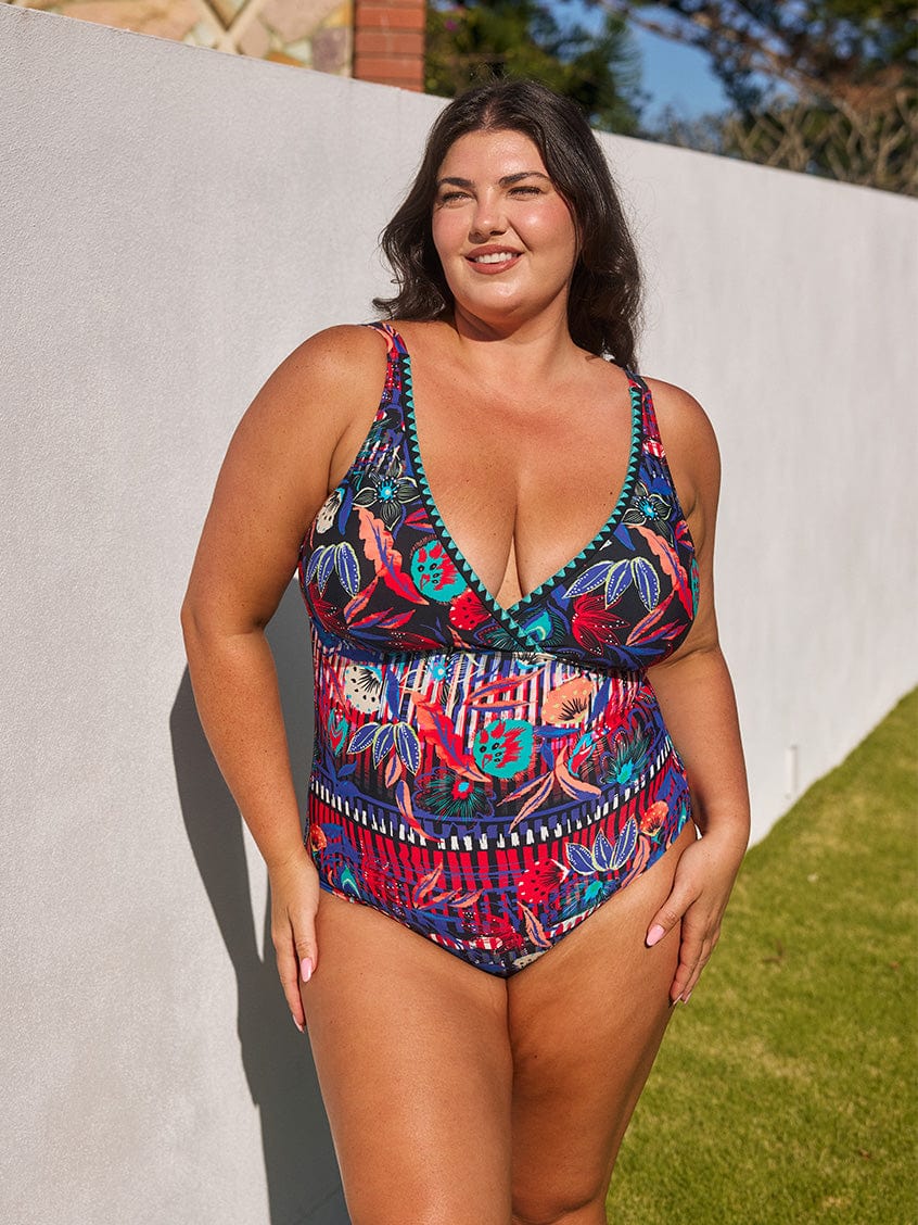 model wearing vibrant floral v neck swimsuit