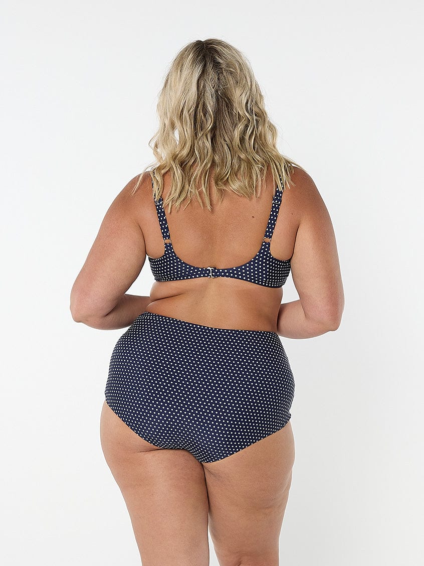 model showing back of navy dots bikini back clip