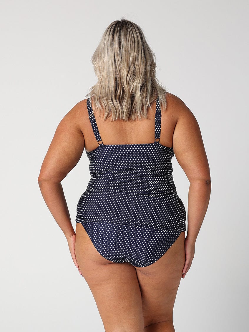 model showing back of navy polka dot swing tankini