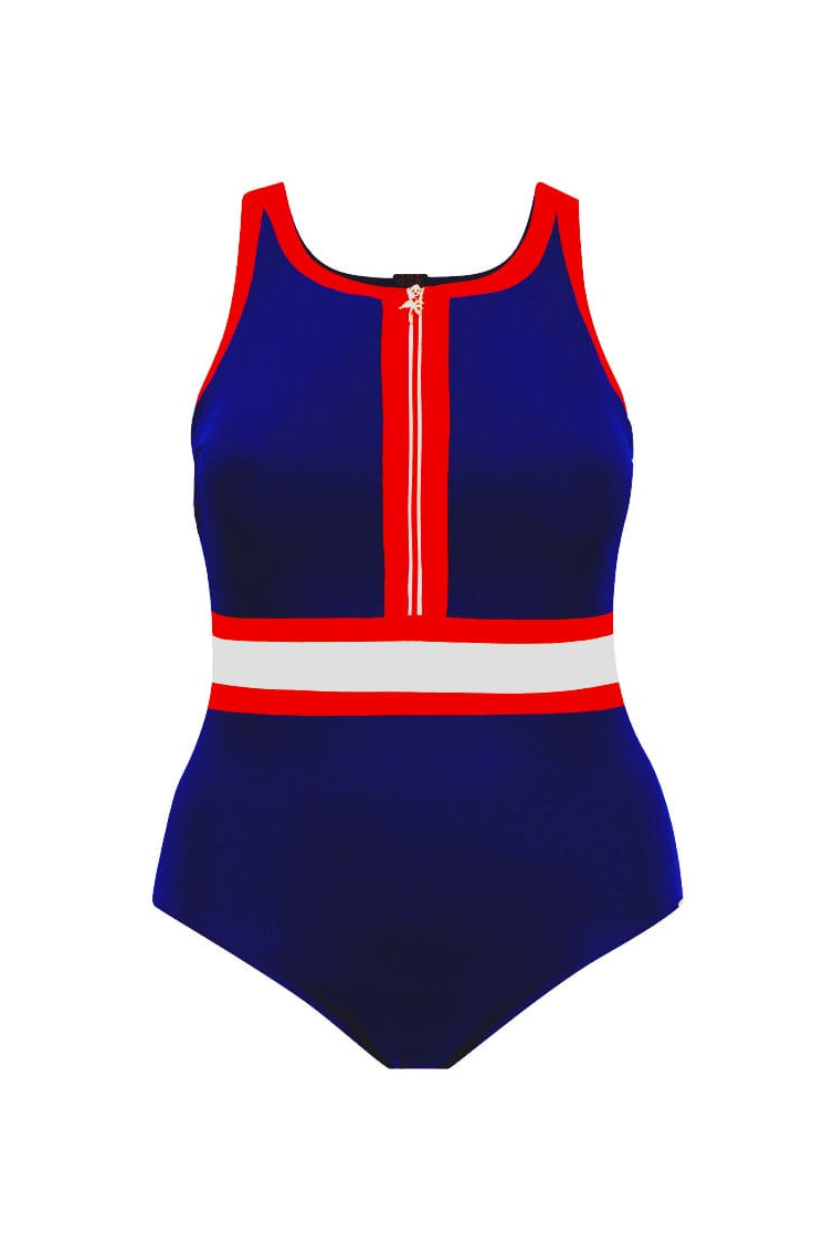 A woman modeling a one-piece swimsuit with a navy blue base and red and white striped accents on the neckline and waist, photographed against a plain light gray studio background.