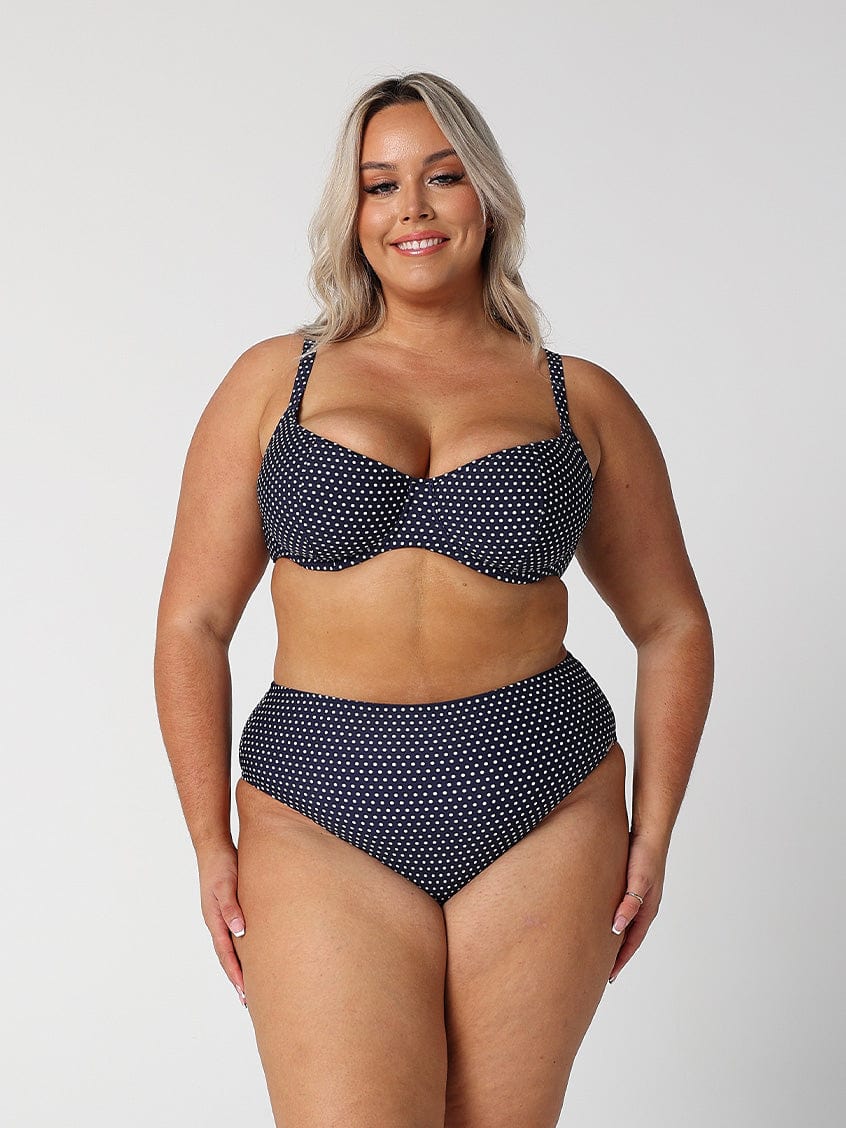 model wearing navy dots high rise swim bottom