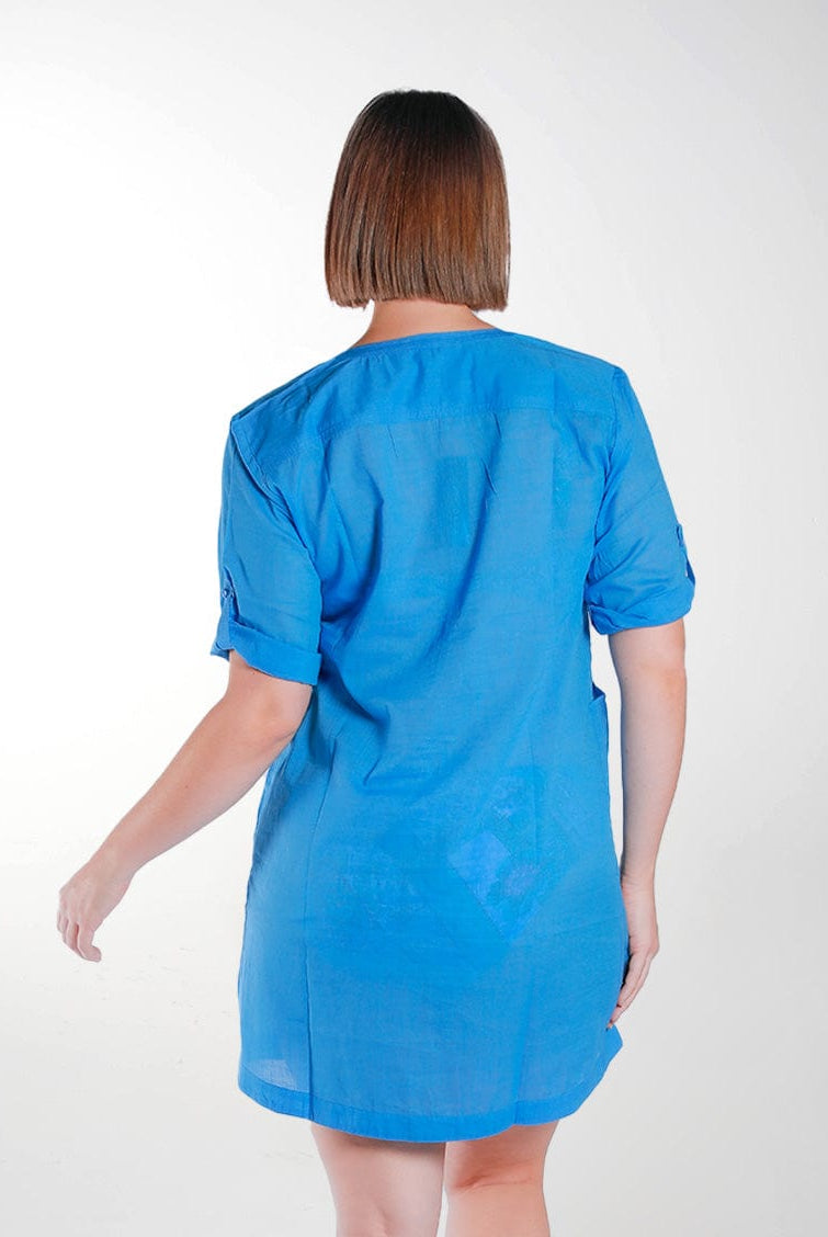 model wears blue v neck over shirt with pockets and roll up sleeves