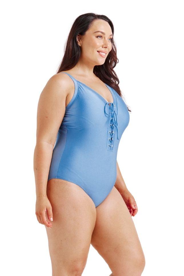 model wearing blue lace up one piece