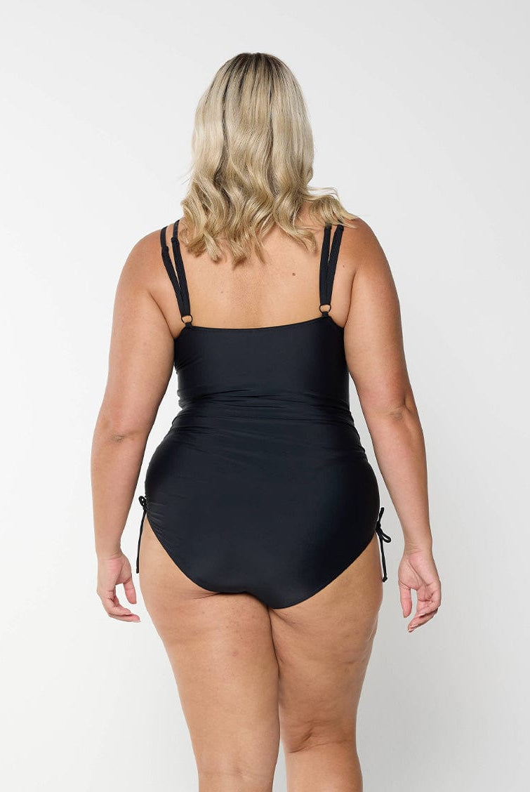 model showing back of side tied women's black one piece