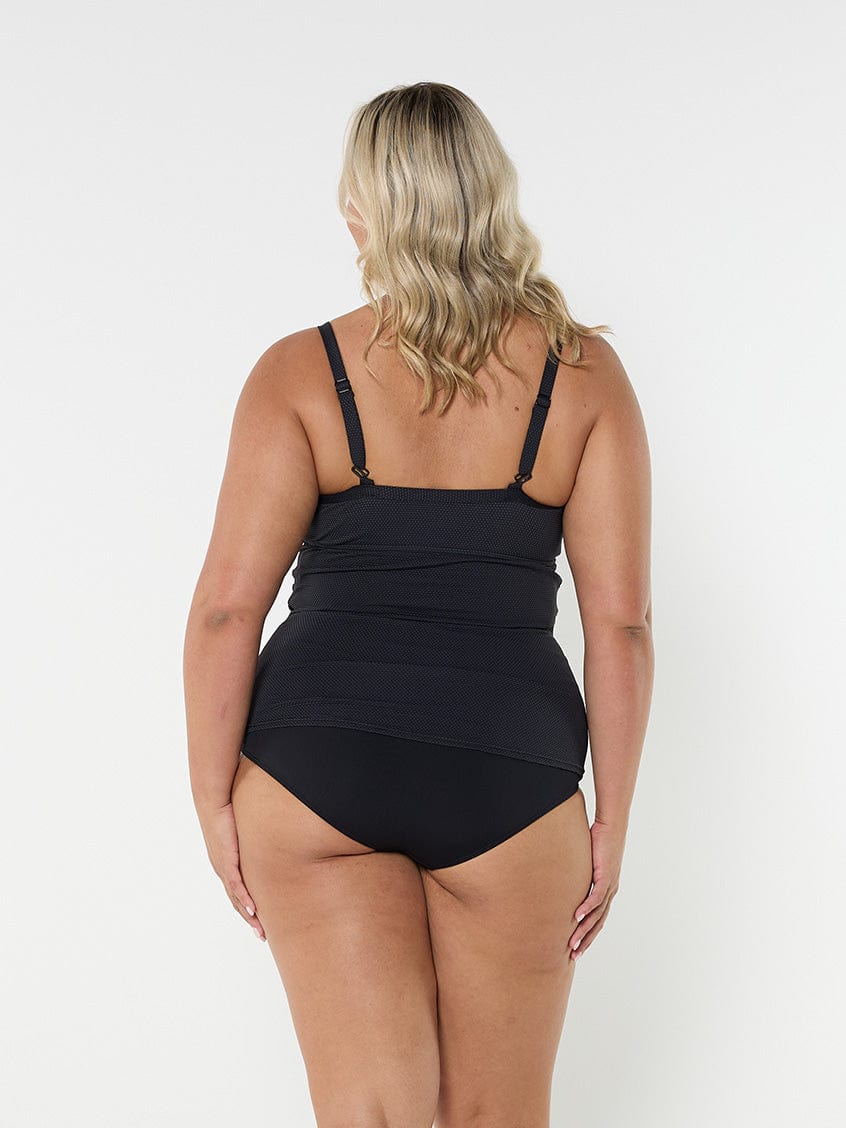 blonde model showing back of black textured tankini