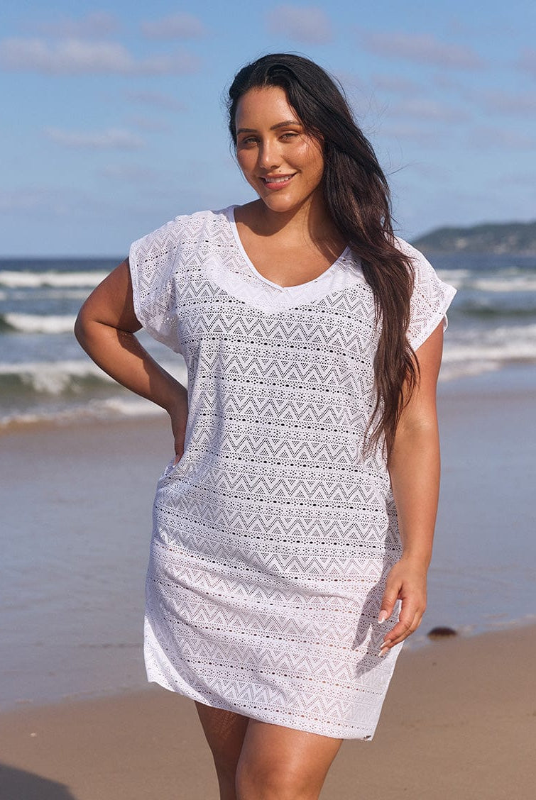 model wearing white mesh cover up
