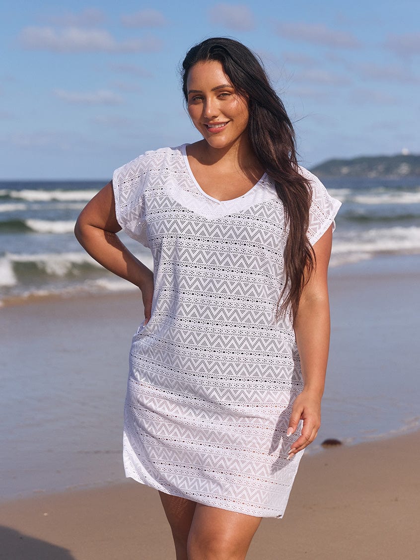 model wearing white mesh cover up