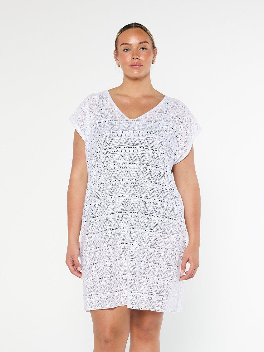model wearing white mesh cover up