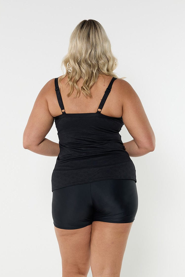 Blonde model showing back of black and white underwire tankini top
