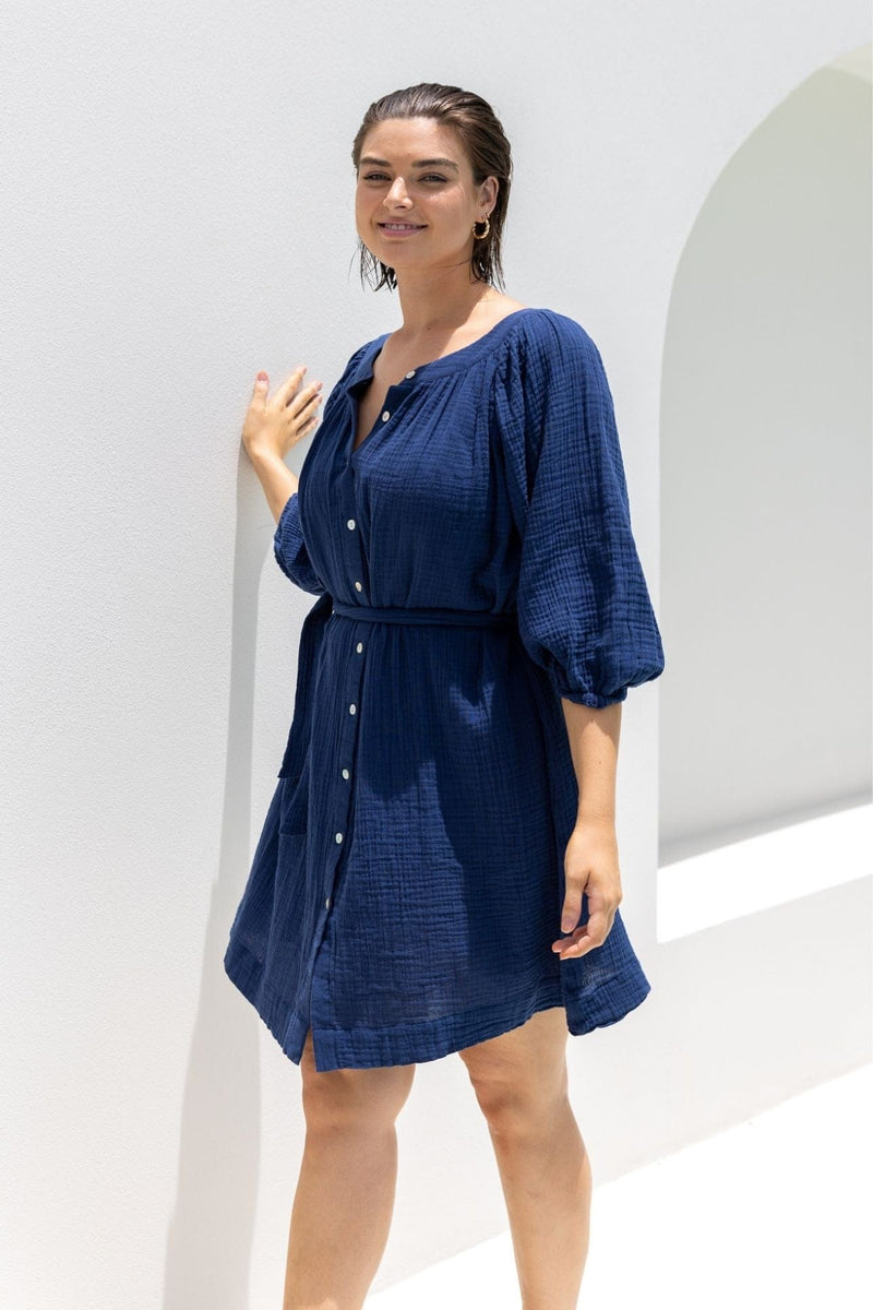 model wearing navy plus size cheesecloth beach dress with buttons
