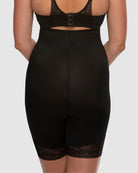 Black shapewear with lace trim on a plain background