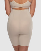Beige shapewear worn by a person on a plain background