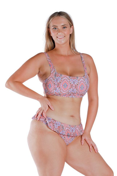 Model wearing pink printed square neck bikini top