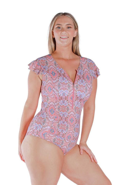 Front Shot of model wearing pink and red toned frilled sleeve one piece with zip front