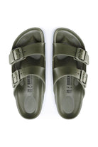 overview photo of khaki rubber flat sandal with 2 adjustable straps over the arch