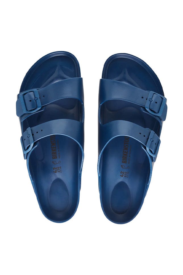 overview shot of the navy rubber beach sandal with 2 adjustable straps over the arch of the foot